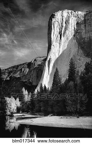 Picture - Rock formations over still rural lake, Yosemite, California, United States. Fotosearch