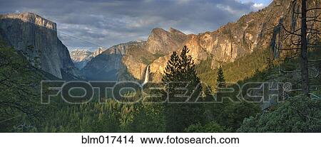 Rocky mountains overlooking rural valley, Yosemite, California, United States View Large Photo Image Picture - Rocky mountains overlooking rural valley, Yosemite, California, United States. Fotosearch