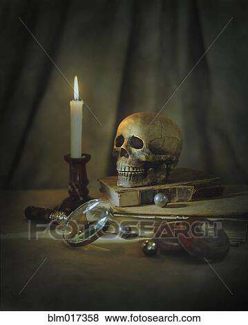 Skull, magnifying glass, candle and books on table View Large Photo Image Stock Photo - Skull, magnifying glass, candle and books on table. Fotosearch
