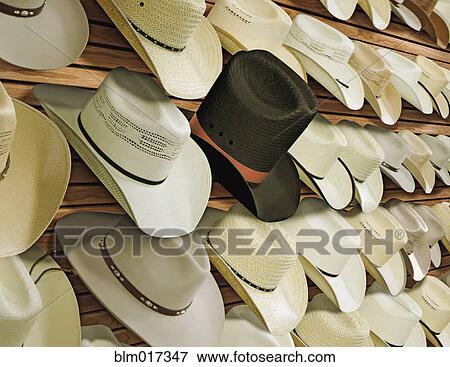 Top hat for sale among cowboy hats View Large Photo Image Stock Photo - Top hat for sale among cowboy hats. Fotosearch
