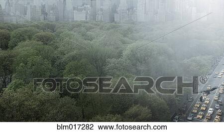 Stock Image - Urban park, skyscrapers and highway, New York, New York, United States. Fotosearch