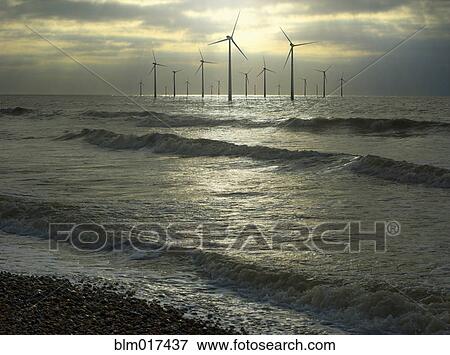Stock Photo - Wind turbines in ocean, Brighton, Sussex, England. Fotosearch