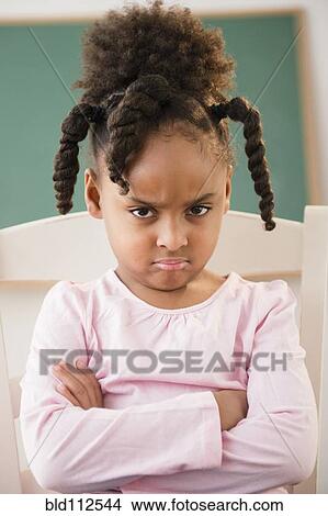 African American girl frowning in classroom View Large Photo Image Picture - African American girl frowning in classroom. Fotosearch