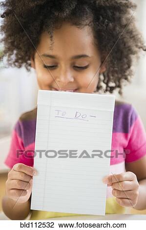 African American girl holding to do list View Large Photo Image Stock Image - African American girl holding to do list. Fotosearch