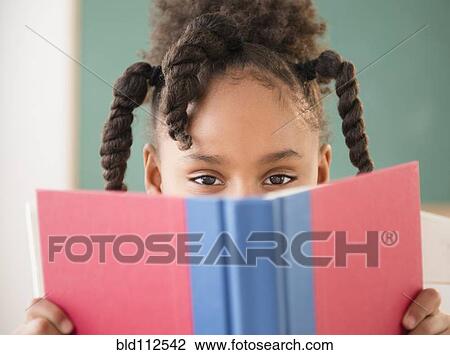African American girl reading book in classroom View Large Photo Image Stock Image - African American girl reading book in classroom. Fotosearch