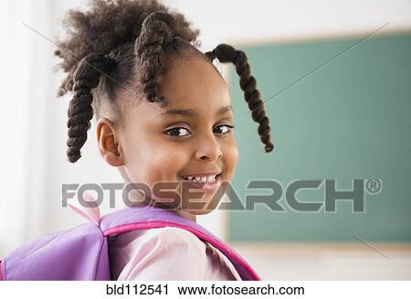 African American girl smiling in classroom View Large Photo Image Stock Image - African American girl smiling in classroom. Fotosearch