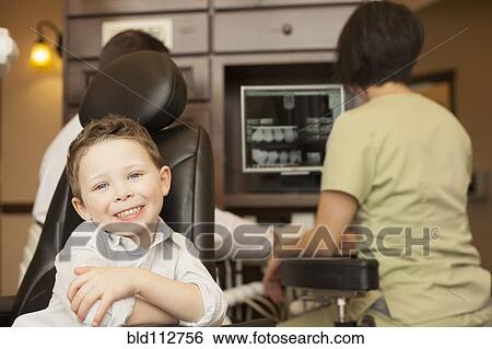 Stock Photograph - Boy smiling in dentist's office. Fotosearch
