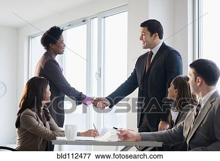 Business people shaking hands in meeting View Large Photo Image Stock Photo - Business people shaking hands in meeting. Fotosearch