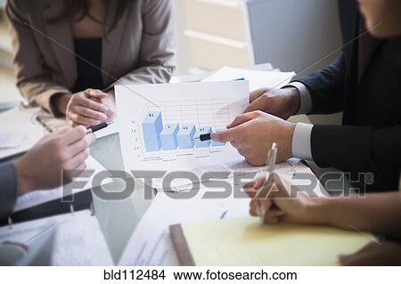 Picture - Business people talking in meeting. Fotosearch