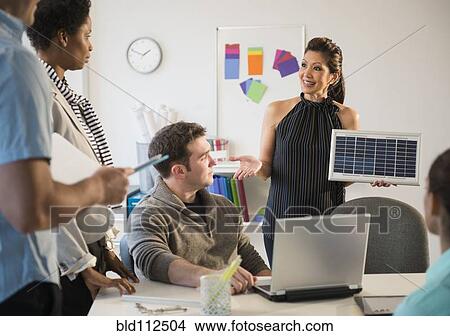 Picture - Business people talking in meeting. Fotosearch