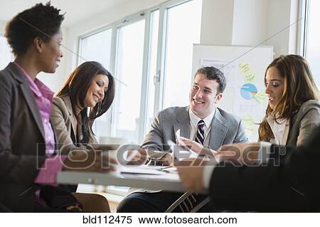 Stock Photography - Business people talking in meeting. Fotosearch