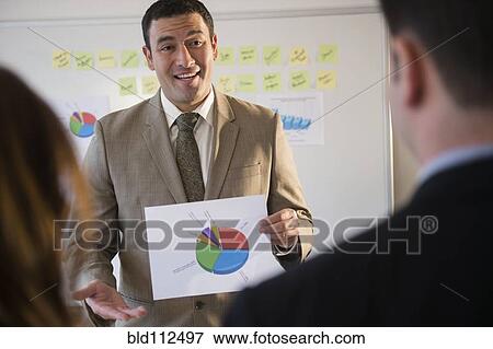 Businessman using graph in meeting View Large Photo Image Stock Photo - Businessman using graph in meeting. Fotosearch