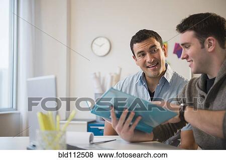 Businessmen talking in office View Large Photo Image Stock Photo - Businessmen talking in office. Fotosearch