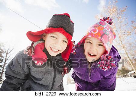 Caucasian children smiling in snow View Large Photo Image Stock Photo - Caucasian children smiling in snow. Fotosearch