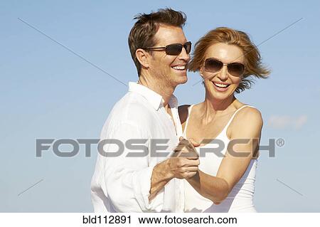 Stock Image - Caucasian couple dancing outdoors. Fotosearch