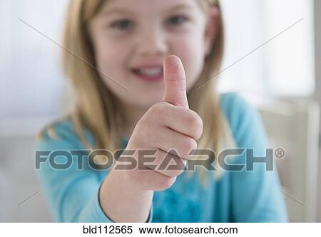 Caucasian girl giving thumbs-up View Large Photo Image Stock Photography - Caucasian girl giving thumbs-up. Fotosearch