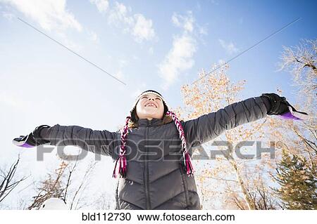 Caucasian girl playing in snow View Large Photo Image Stock Image - Caucasian girl playing in snow. Fotosearch