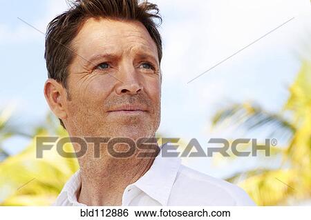 Stock Photograph - Caucasian man standing outdoors. Fotosearch