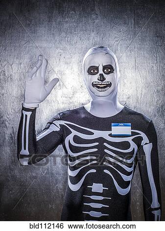 Stock Photograph - Caucasian man wearing skeleton costume. Fotosearch