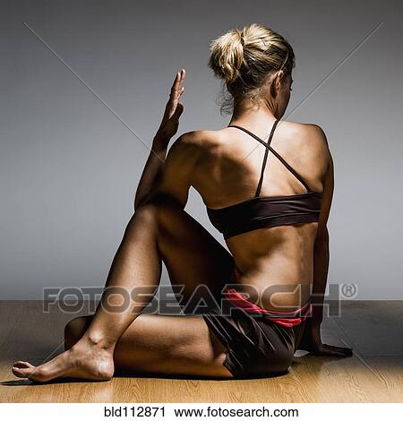 Caucasian woman practicing yoga in studio View Large Photo Image Stock Image - Caucasian woman practicing yoga in studio. Fotosearch