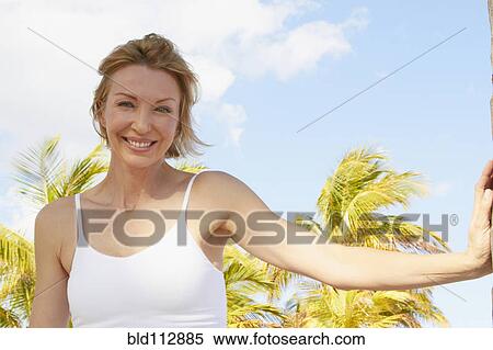 Caucasian woman smiling outdoors View Large Photo Image Stock Photography - Caucasian woman smiling outdoors. Fotosearch
