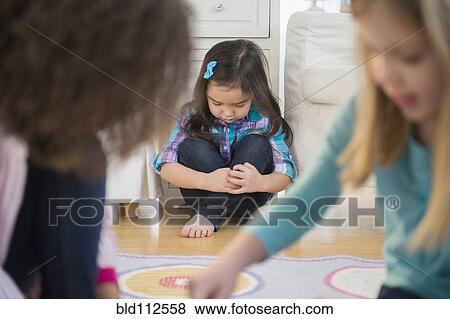 Girls playing without friend in living room View Large Photo Image Stock Photo - Girls playing without friend in living room. Fotosearch