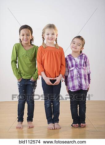 Girls smiling together in bare feet View Large Photo Image Picture - Girls smiling together in bare feet. Fotosearch