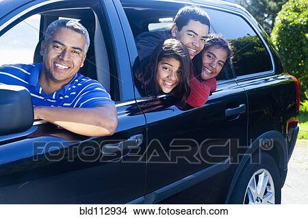 Hispanic family smiling in car View Large Photo Image Picture - Hispanic family smiling in car. Fotosearch