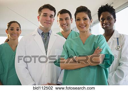 Nurses and doctors smiling in hospital View Large Photo Image Stock Image - Nurses and doctors smiling in hospital. Fotosearch