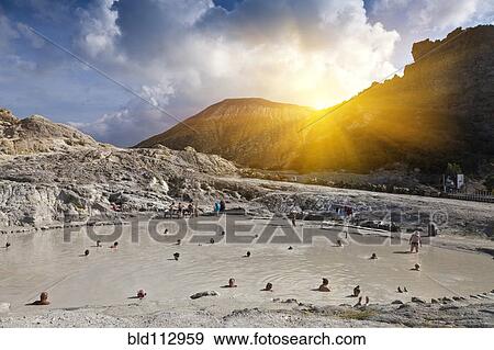 Stock Photo - People bathing in hot springs, Isle Vulcano, Sicily, Italy. Fotosearch