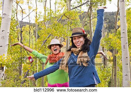 Playful friends enjoying forest View Large Photo Image Stock Photograph - Playful friends enjoying forest. Fotosearch