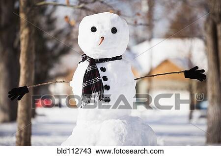 Snowman wearing scarf outdoors View Large Photo Image Stock Image - Snowman wearing scarf outdoors. Fotosearch