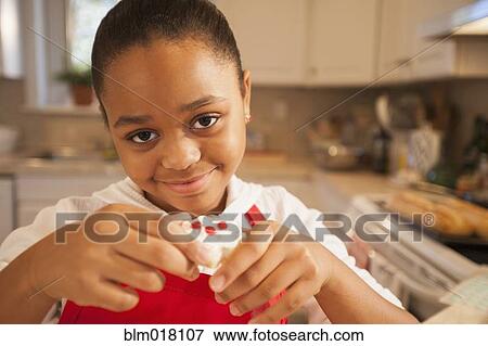 African American girl baking in kitchen View Large Photo Image Stock Photo - African American girl baking in kitchen. Fotosearch