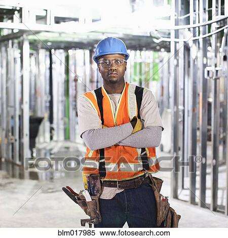 Stock Photography - African American standing on site. Fotosearch