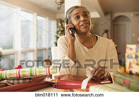 African American woman talking on cell phone View Large Photo Image Stock Image - African American woman talking on cell phone. Fotosearch