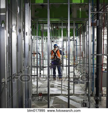 Stock Photography - African American worker on site. Fotosearch