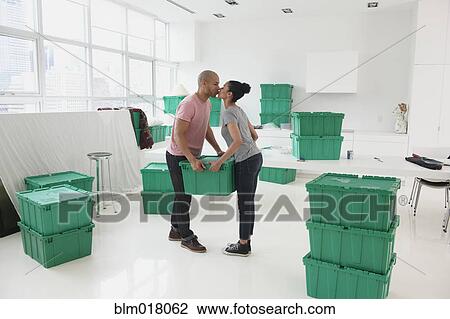 Black couple kissing in new house View Large Photo Image Stock Image - Black couple kissing in new house. Fotosearch