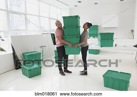 Black couple moving into new house View Large Photo Image Stock Image - Black couple moving into new house. Fotosearch