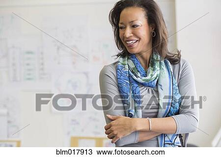 Black woman smiling in classroom View Large Photo Image Stock Image - Black woman smiling in classroom. Fotosearch