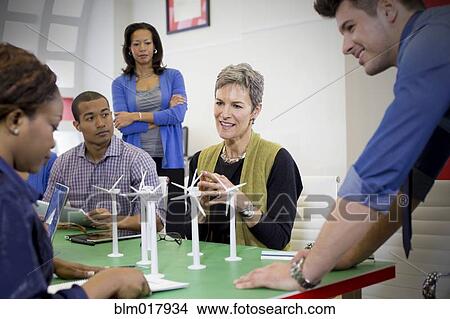 Picture - Business people talking in meeting. Fotosearch
