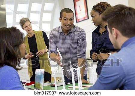 Stock Photo - Business people talking in meeting. Fotosearch