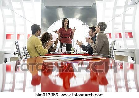 Stock Photograph - Business people talking in meeting. Fotosearch