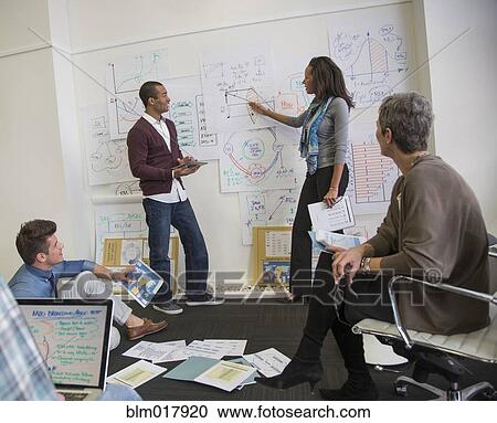 Business people talking in office View Large Photo Image Stock Image - Business people talking in office. Fotosearch