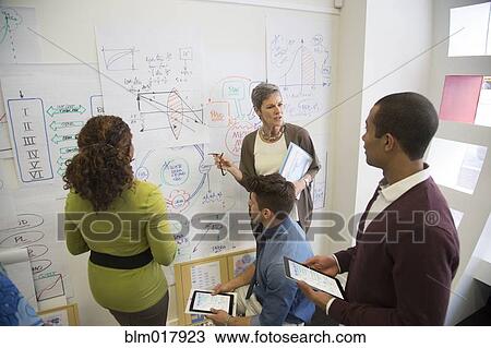 Business people talking in office View Large Photo Image Stock Image - Business people talking in office. Fotosearch