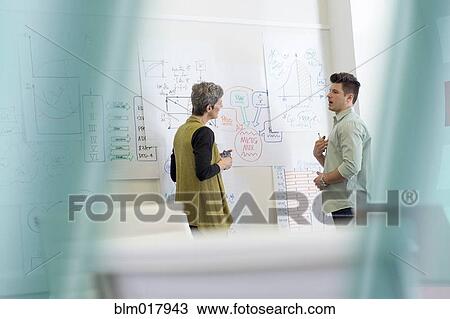 Business people talking in office View Large Photo Image Stock Image - Business people talking in office. Fotosearch
