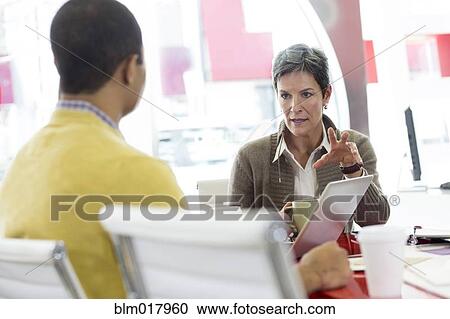 Business people talking in office View Large Photo Image Stock Image - Business people talking in office. Fotosearch