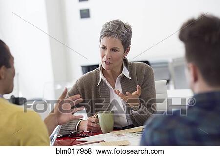 Business people talking in office View Large Photo Image Stock Photo - Business people talking in office. Fotosearch