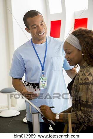 Stock Photo - Business people talking in office. Fotosearch