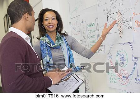 Business people talking in office View Large Photo Image Stock Photograph - Business people talking in office. Fotosearch