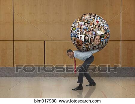 Businessman carrying globe on his back View Large Photo Image Stock Image - Businessman carrying globe on his back. Fotosearch